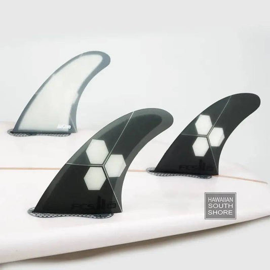 FCS II TRI-QUAD Al Merrick PC+AirCore Large Grey on a surfboard