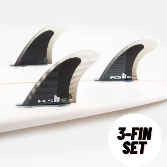 FCS II THRUSTER Reactor Performance Core Black Charcoal on a surfboard