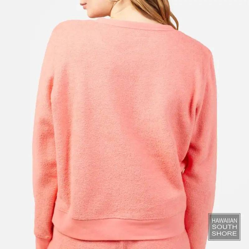 Outerknown Sweater Women's Hightide Crew in bright coral worn by a woman showing the back view