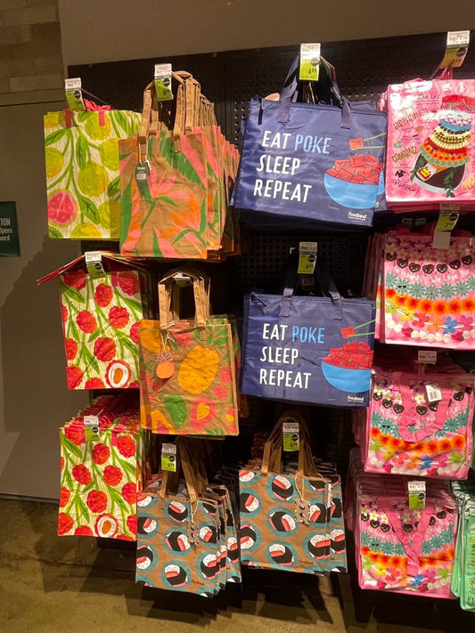 Colorful reusable Foodland tote bags on display, popular Hawaii souvenir gifts