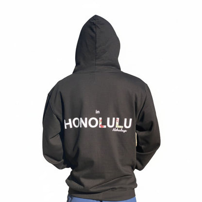 Black Aloha Days hoodie back view showing white tropical flower design on dark fabric