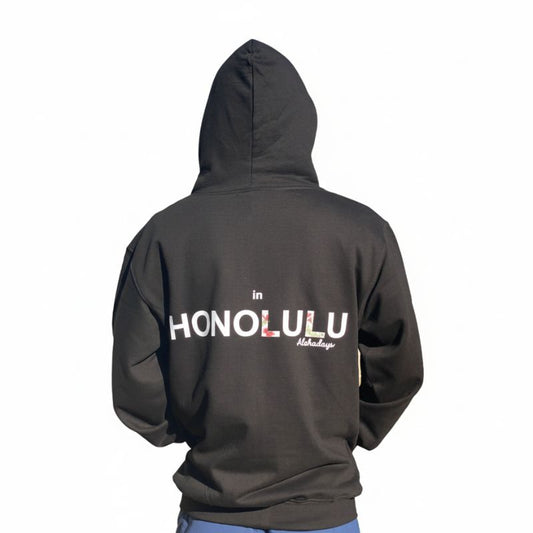 Black Aloha Days hoodie back view showing white tropical flower design on dark fabric