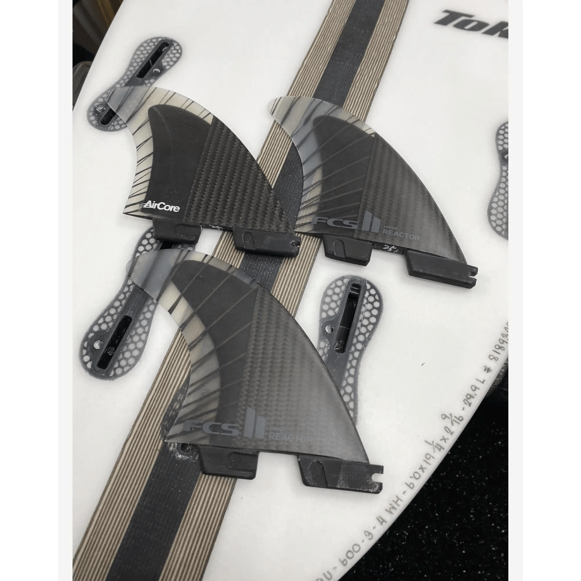 Shop FCS II Reactor PC Carbon Tri Fins Black Charcoal - Surf
